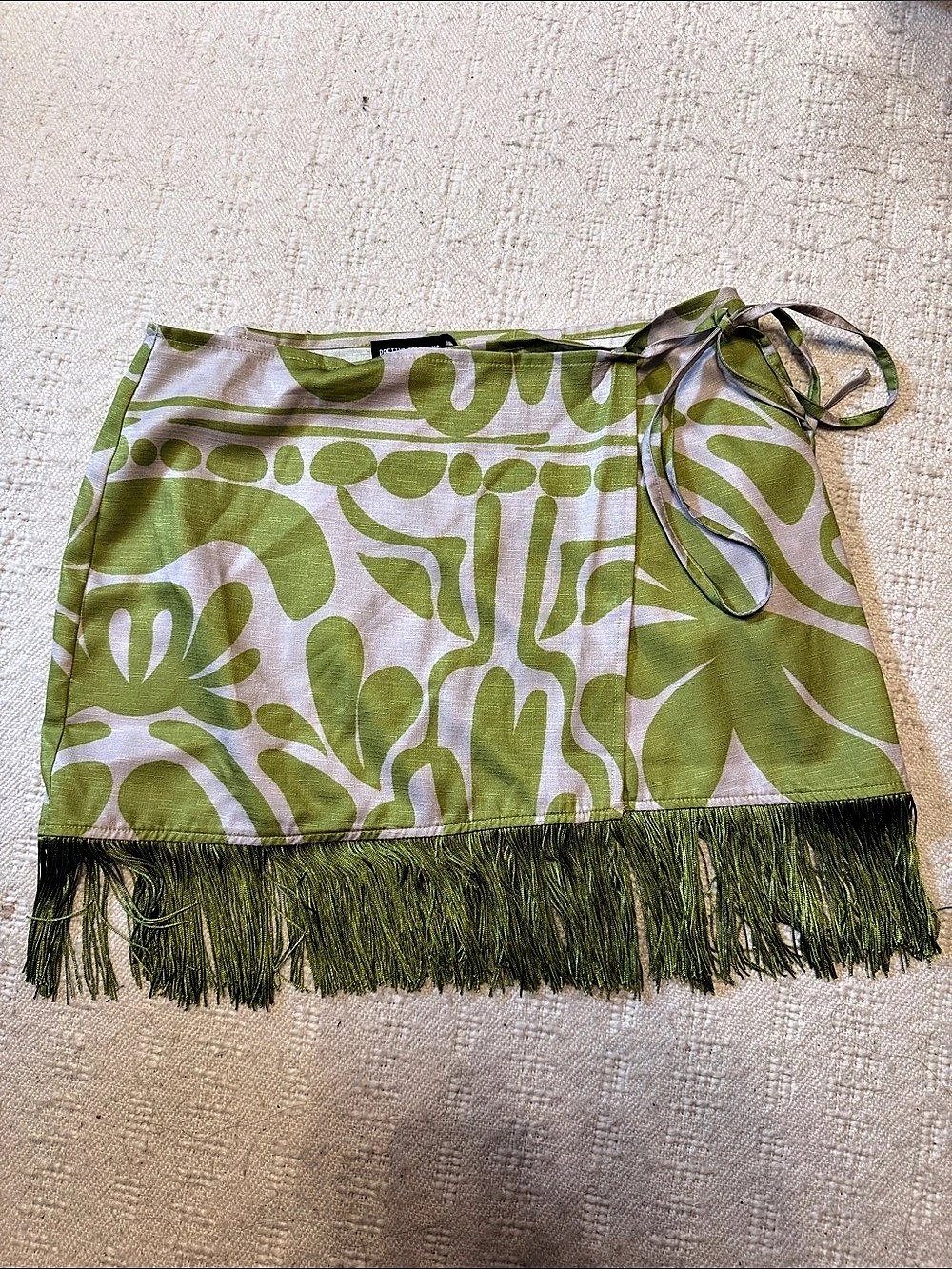 PrettyLittleThing Green Abstract Floral Tassel Hem Wrap Mini Skirt Green & White